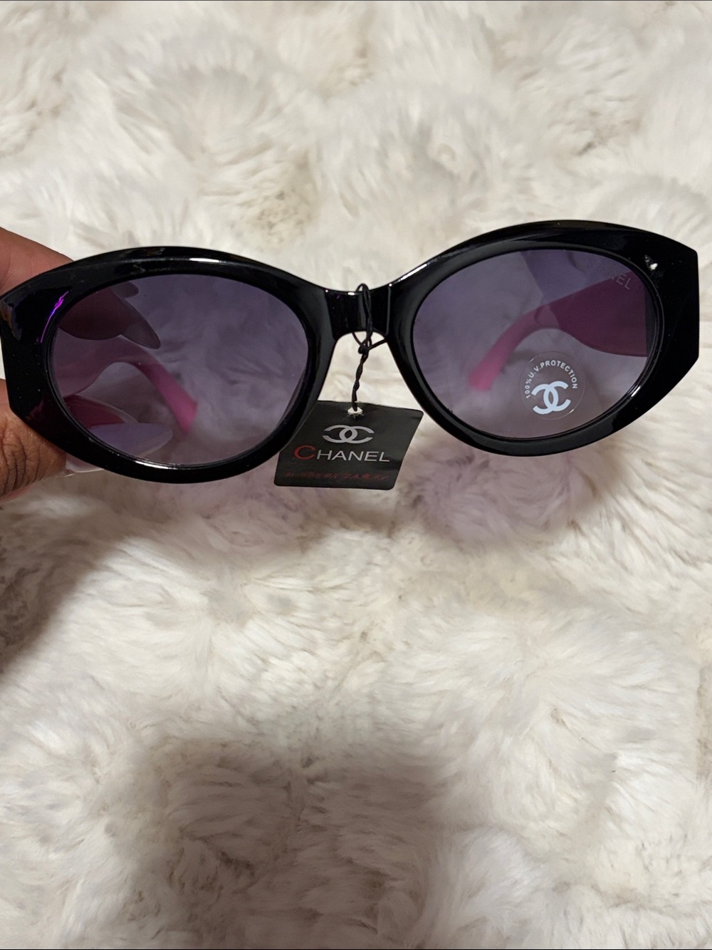 Black Frame Sunglasses with Purple Lenses and pink legs.